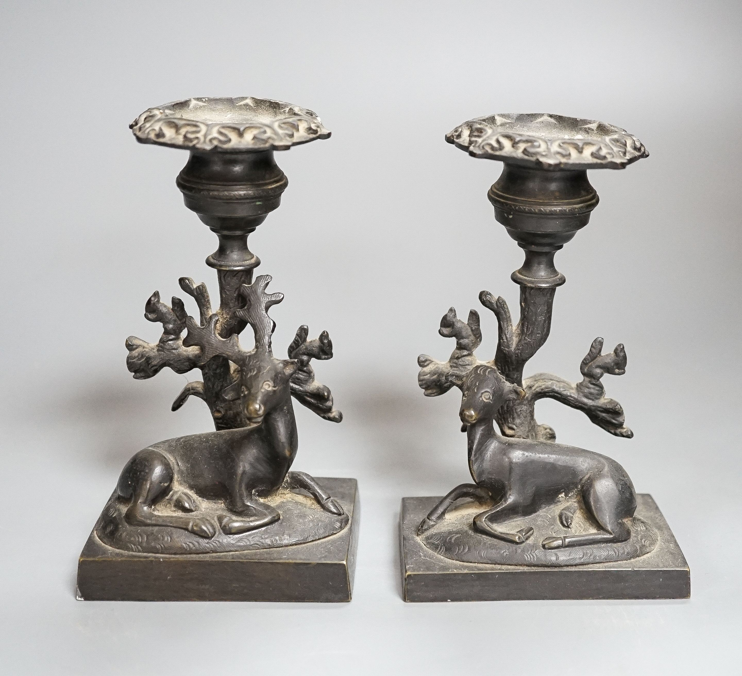A pair of 19th century bronze ‘stag and doe’ dwarf candlesticks 14cm